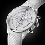 White watch with detailed face on a black background