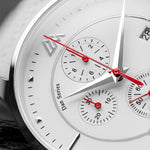 Close-up of a watch with a white face and red hands, featuring the Dan Series branding.