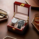 Two Matthew Mercury Chronograph Watches in a wooden luxury box with a glass of whiskey on a wooden table.