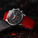 Matthew Mercury Chronograph Watch with red strap on a dark textured surface