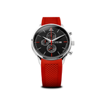 Wristwatch with red strap and black dial on a white background