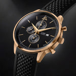 Magnum Gold chronograph by Matthew Mercury Watches with black dial, textured black rubber strap, and 18‑karat‑gold case, crown and pushers.