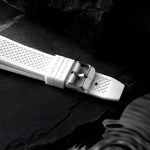 White rubber watch strap with silver buckle