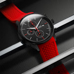 Watch with a black case and a red strap