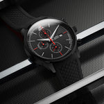 Black wristwatch with detailed face on a metallic background